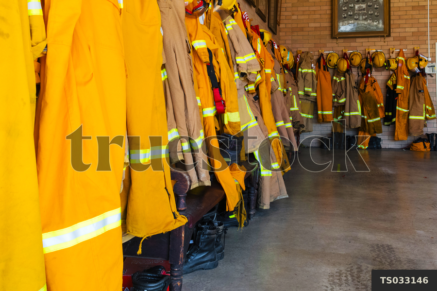 TS033146 Firefighter bunker gear hanging in fire station by Rowena ...