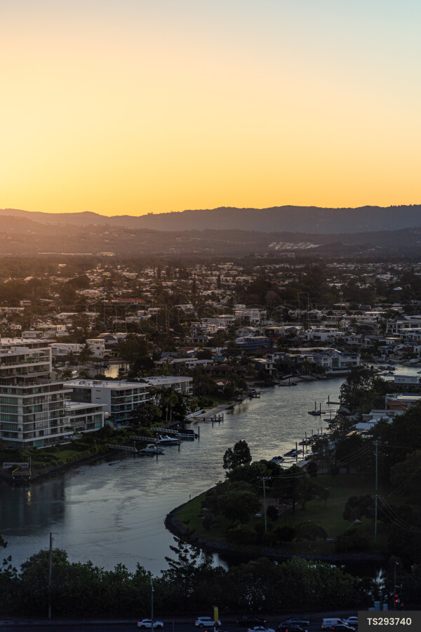 Scenic view of cityscape and river at sunset