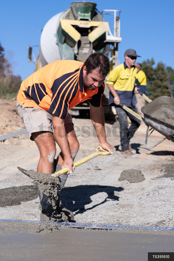 Workman Laying Concrete