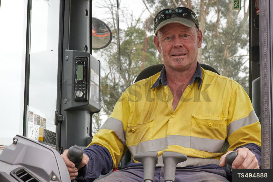 Portrait of a digger driver in a digger