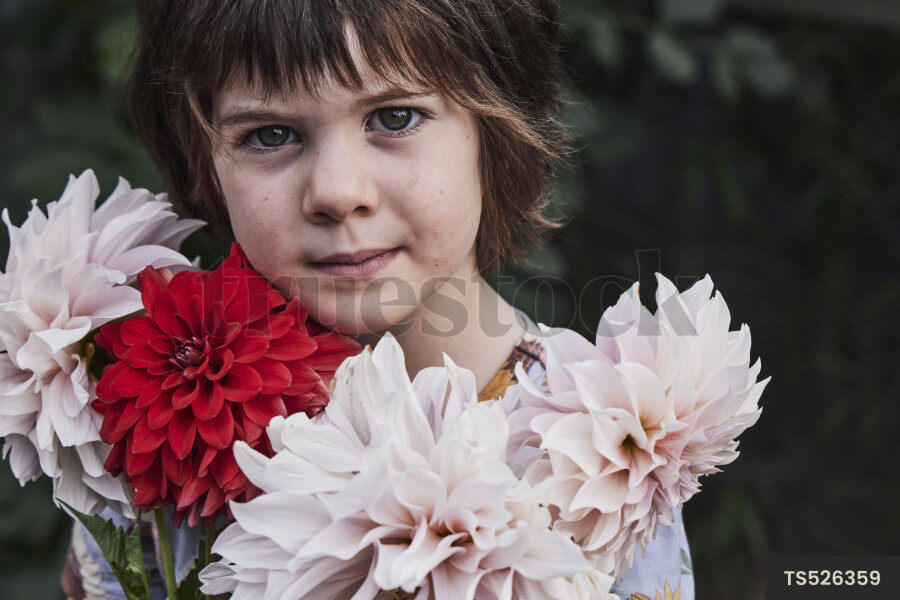 Young Girl Holding Flowers