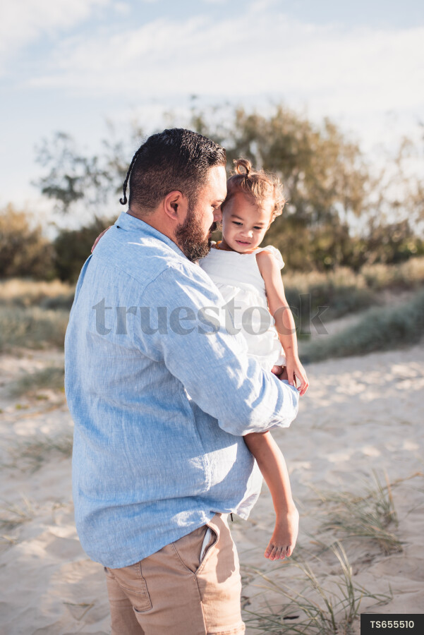 Dad with daughter at the beach