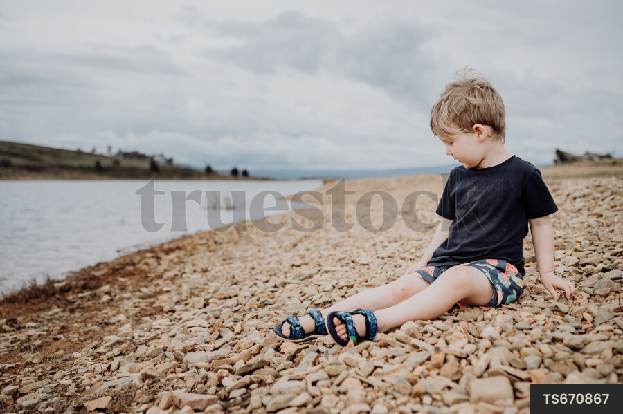 Young Boy Playing at Lake