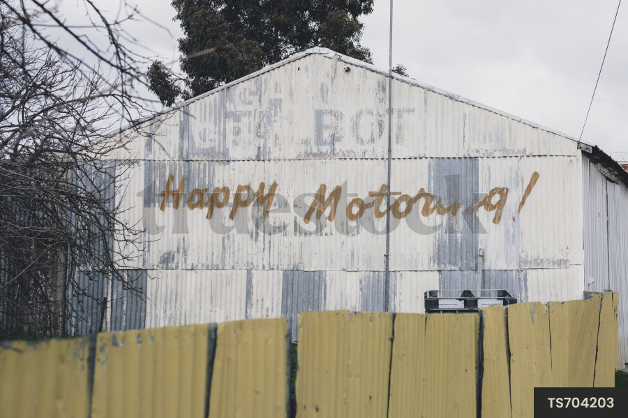 TS704203 Happy Motoring sign painted on a shed by Rowena Naylor - Truestock
